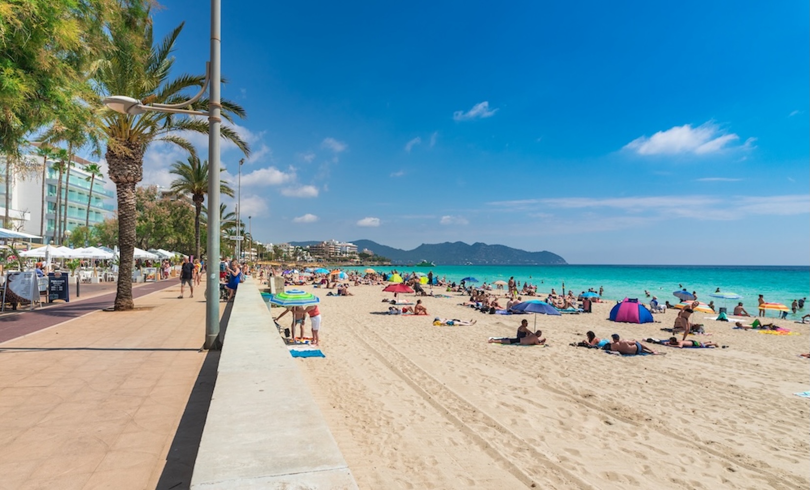 Majorca, Spain - June 1st 2018: Tourists at summer beach holiday at coast of Cala Millor on Mallorca island, Spain Mediterranean Sea