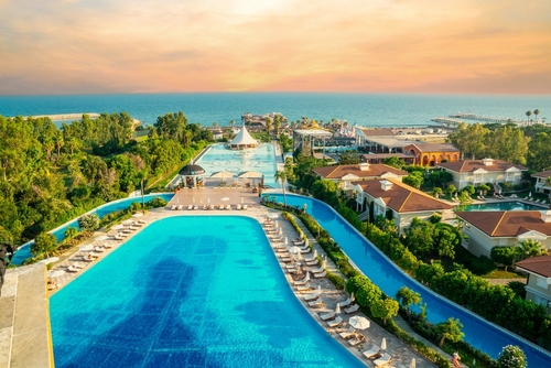 Sandy beaches of the Mediterranean. Kundu - Belek holiday complex with five star hotels. Beach, sea, water sports, parasailing, entertainment and shopping center. Antalya, Turkey